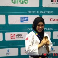 Atlet taekwondo Defia Rosmaniar menyumbang medali emas pertama untuk Indonesia di Asian Games 2018. Defia meraih emas nomor individu poomsae putri Liputan6.com  Lutfie Febrianto