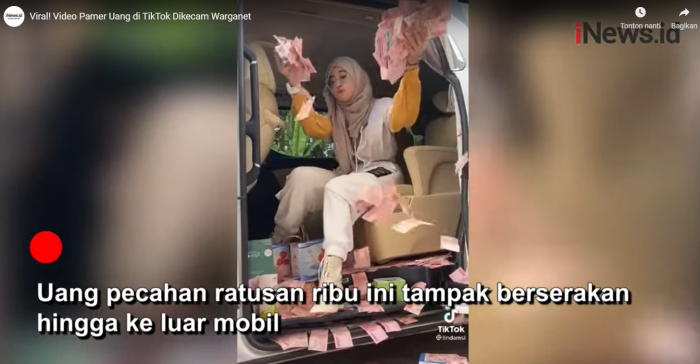 Viral! Menghamburkan Uang ke Jalan, Wanita Berhijab Ini Di-Bully Netizen